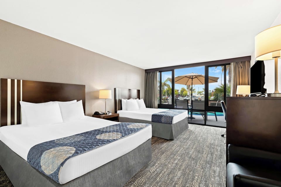 Standard Room, 2 Queen Beds, Non Smoking, Microwave | Desk, blackout drapes, iron/ironing board, cribs/infant beds