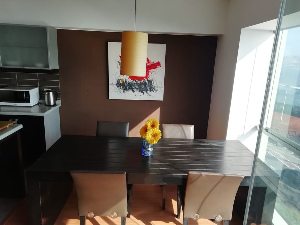 Apartment, 1 Bedroom, Ocean View | Living room | Flat-screen TV