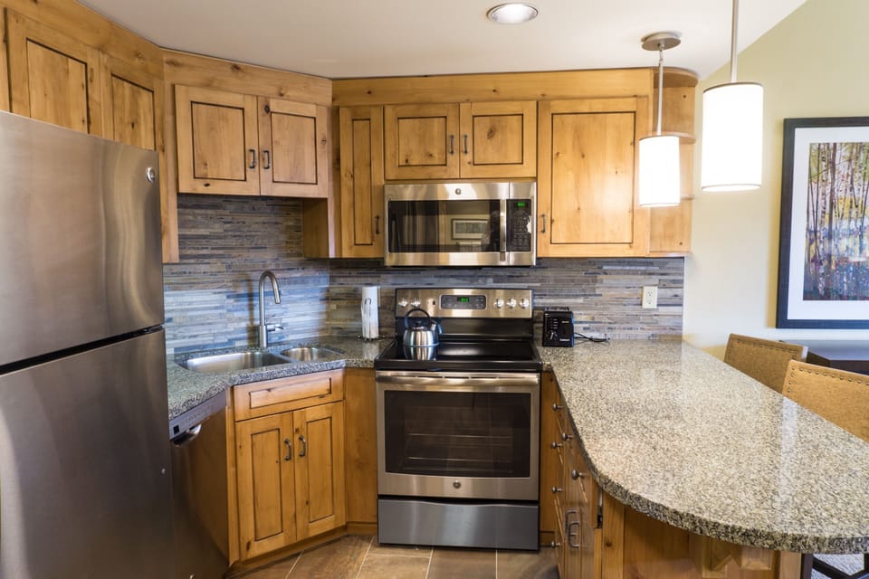Condo, 1 Bedroom | Private kitchen | Full-size fridge, microwave, oven, stovetop