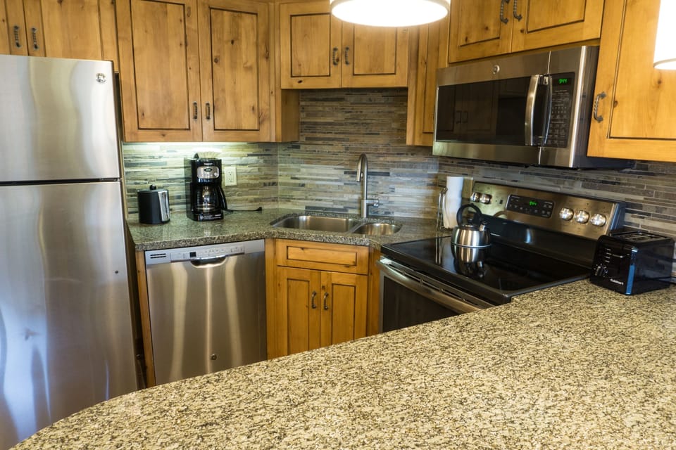 Condo, 1 Bedroom | Private kitchen | Full-size fridge, microwave, oven, stovetop
