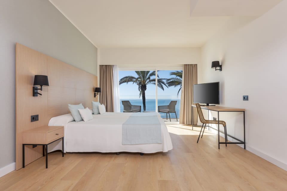 Junior Suite, Balcony, Sea View | In-room safe, desk, free WiFi, bed sheets