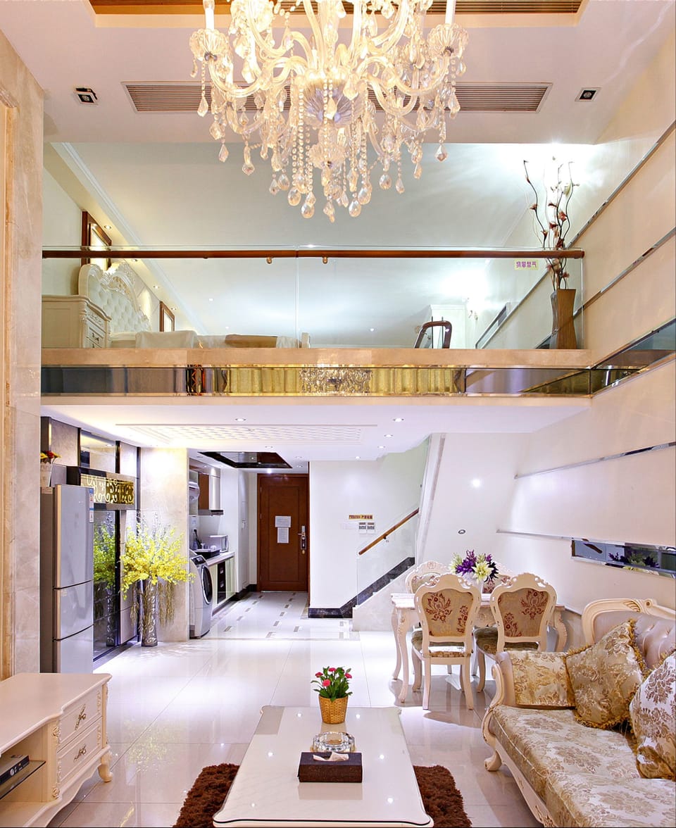 Deluxe Double  Loft | Living area | 40-inch flat-screen TV with cable channels, TV