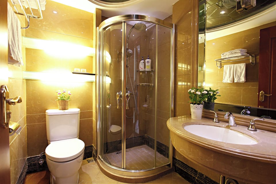 Shower, free toiletries, hair dryer, slippers