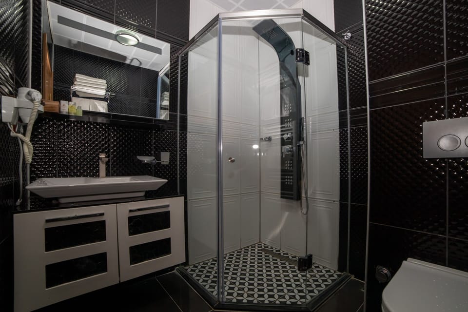 Shower, free toiletries, hair dryer, bathrobes