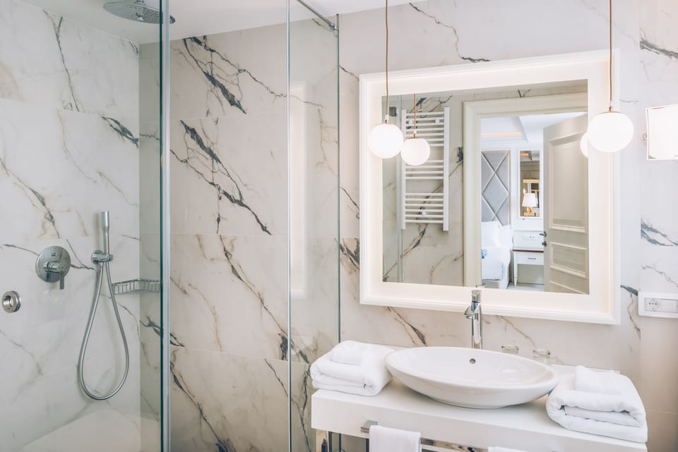 Shower, eco-friendly toiletries, hair dryer, bathrobes