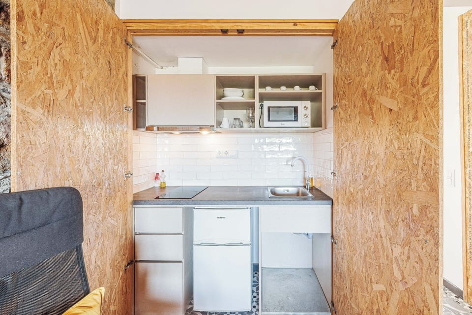 Studio, 2 Bedrooms | Private kitchenette | Shared fridge, microwave, coffee/tea maker