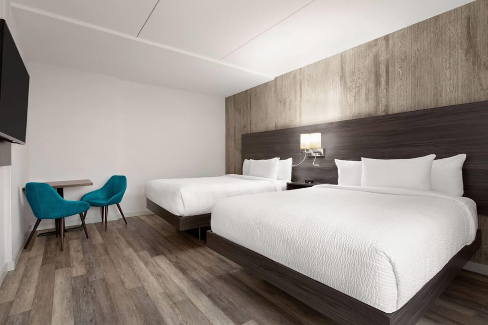 2 Queen Beds, Non Smoking (Mobility, Roll-In Shower) | Pillowtop beds, iron/ironing board, free WiFi, bed sheets