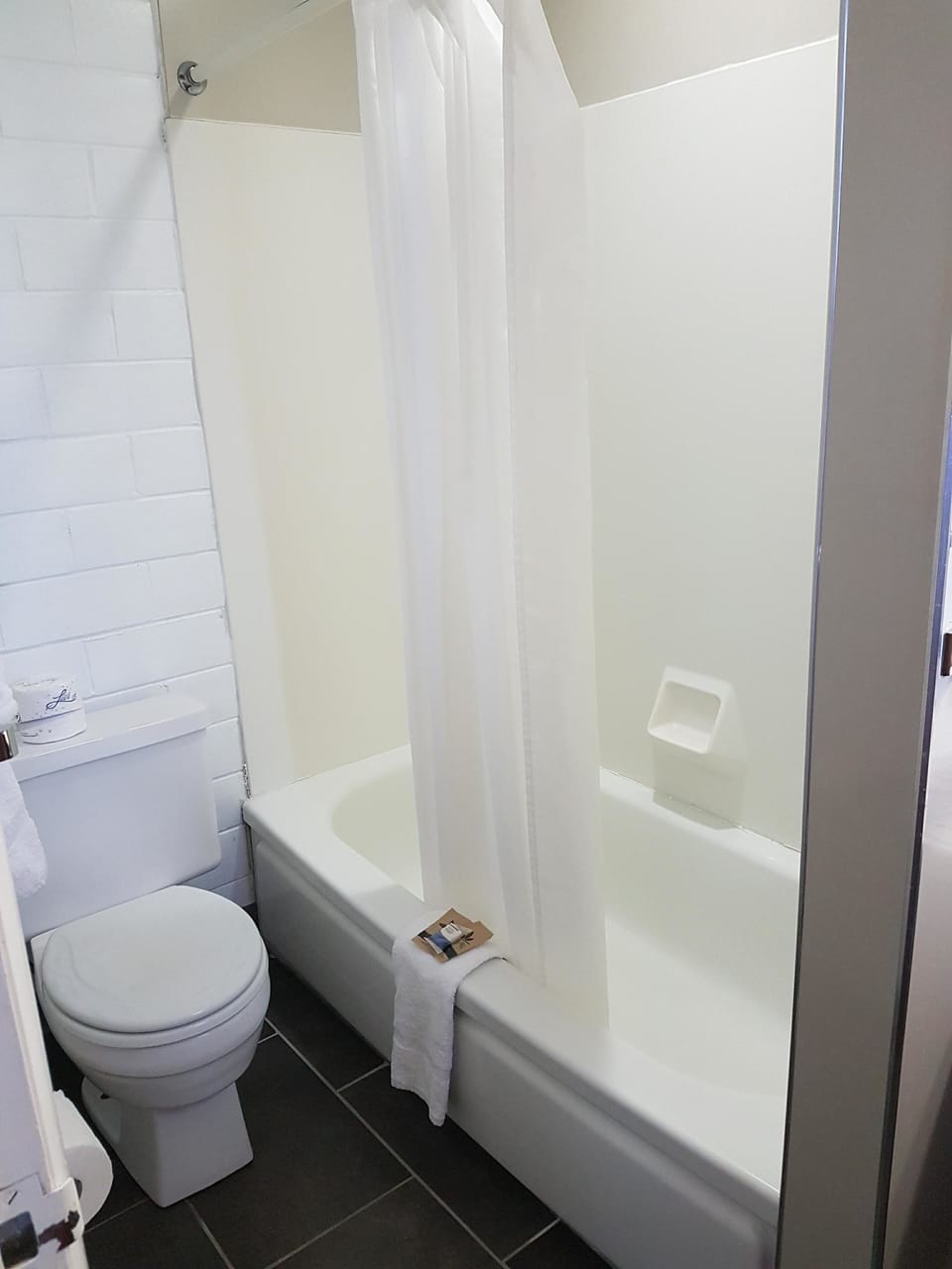 Room, 2 Double Beds | Bathroom | Combined shower/tub, free toiletries, towels