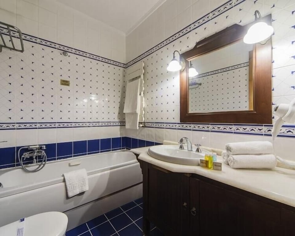 Shower, free toiletries, hair dryer, slippers