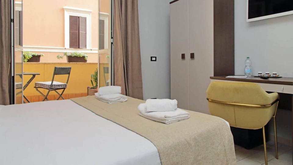 Triple Room private balcony | Minibar, in-room safe, desk, soundproofing