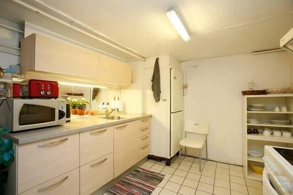 Family Apartment, 2 Bedrooms, Fireplace | Private kitchen | Full-size fridge, microwave, oven, stovetop