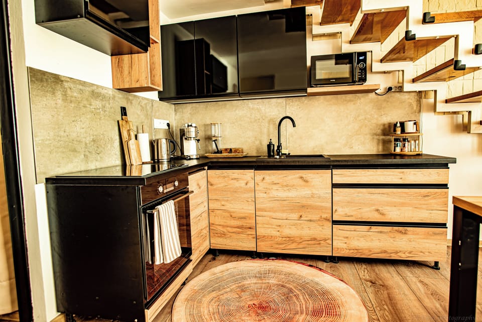 Family Studio Suite | Private kitchen | Full-size fridge, oven, stovetop, highchair