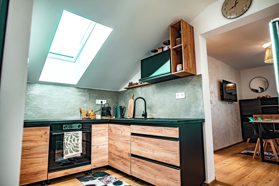 Family Studio Suite | Private kitchen | Full-size fridge, oven, stovetop, highchair