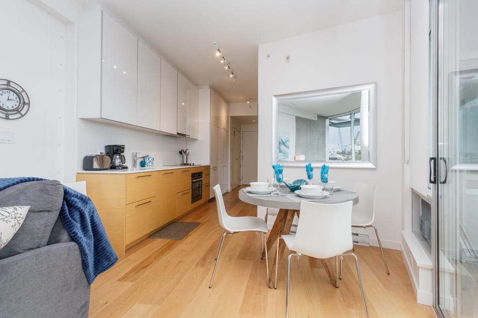 A turn-key kitchen layout flowing directly into the dining area, making home cooking during multi-month stays an absolute breeze.