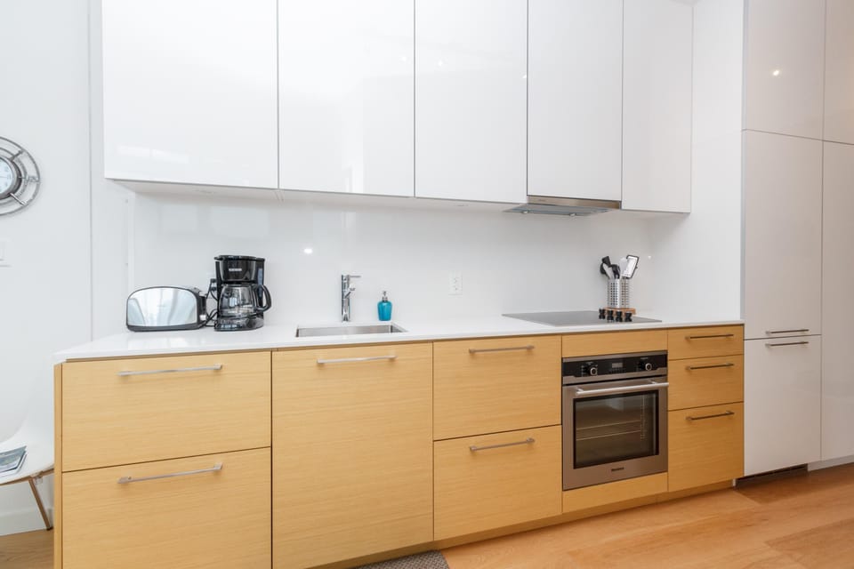 The chef-inspired kitchen comes fully equipped with premium built-in appliances for all your culinary needs.