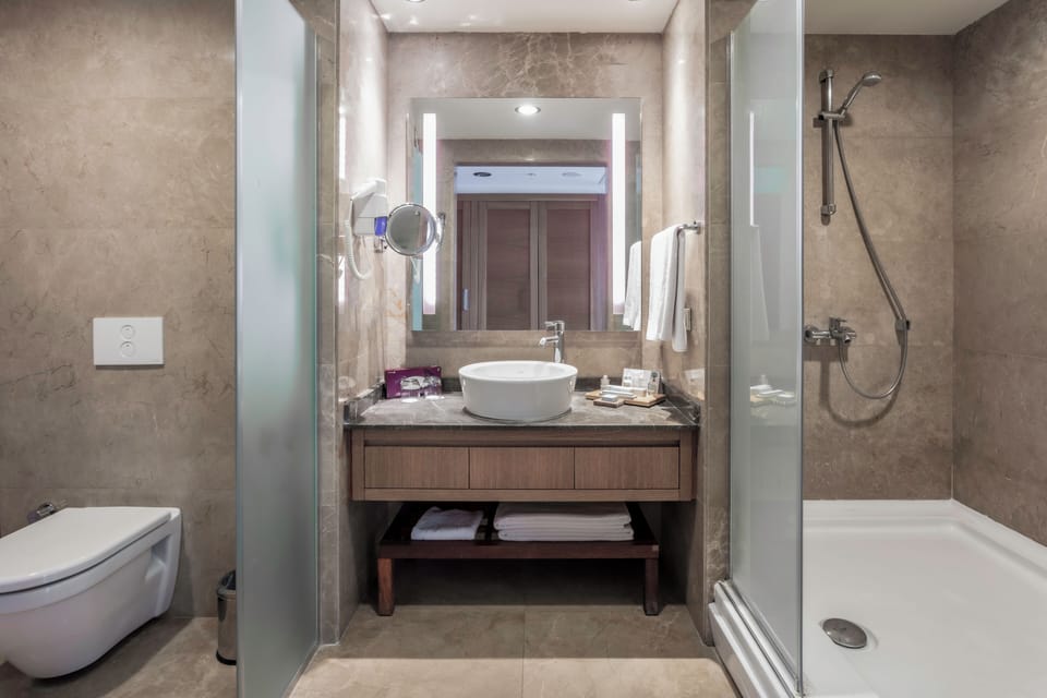 Standard Quadruple Room, Sea View | Bathroom | Shower, free toiletries, hair dryer, towels
