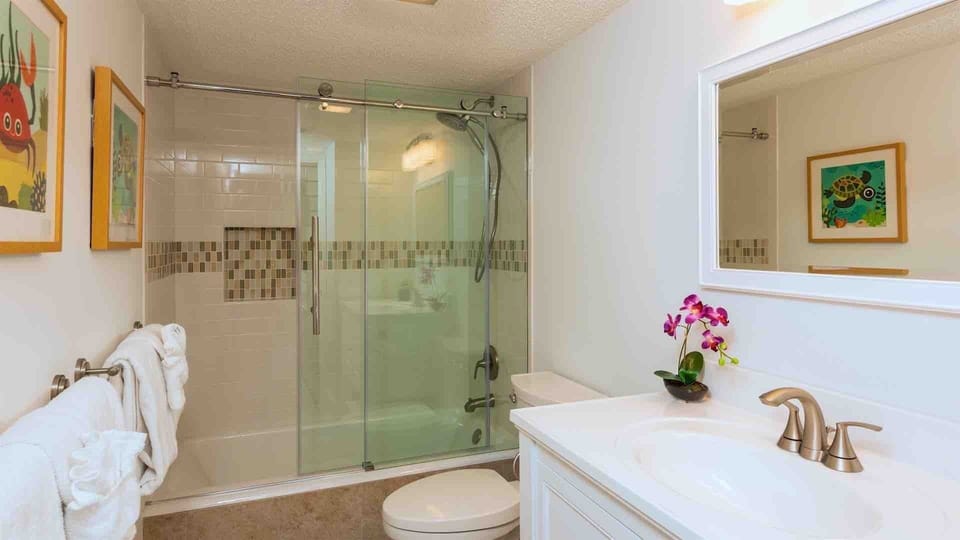 The second bathroom is across the hall and has a beautiful large custom shower...