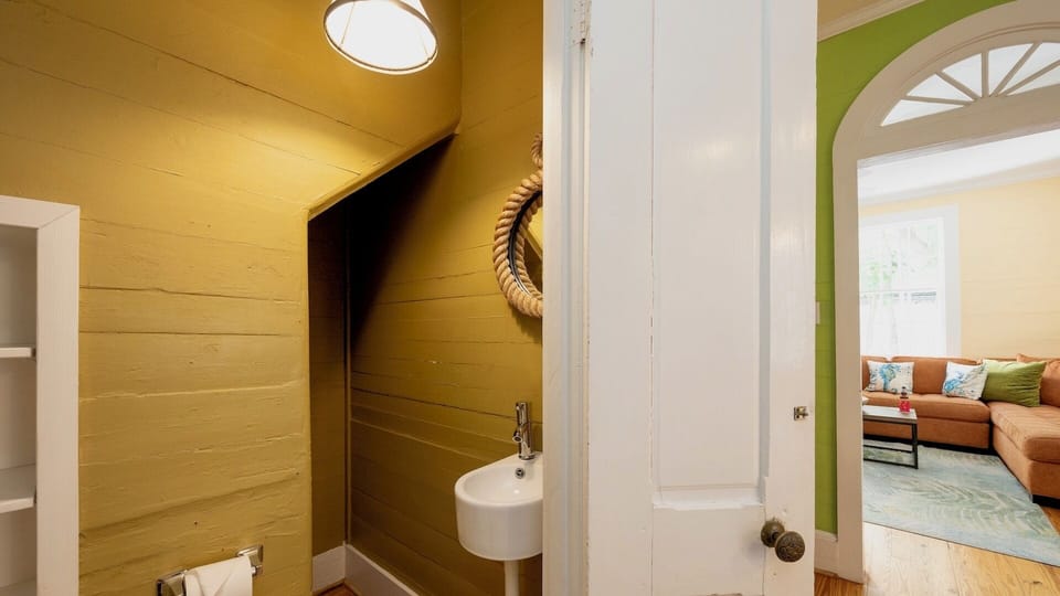 There's a convenient half bath just off the living room...