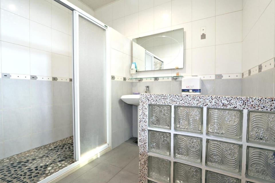 Shower, free toiletries, slippers, towels