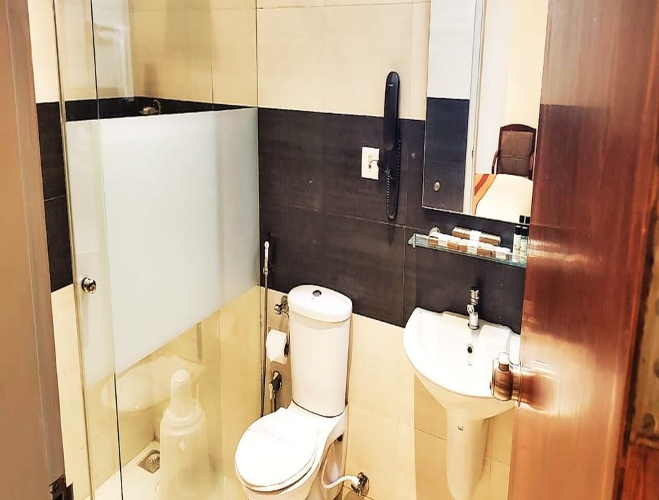 Shower, rainfall showerhead, bathrobes, towels