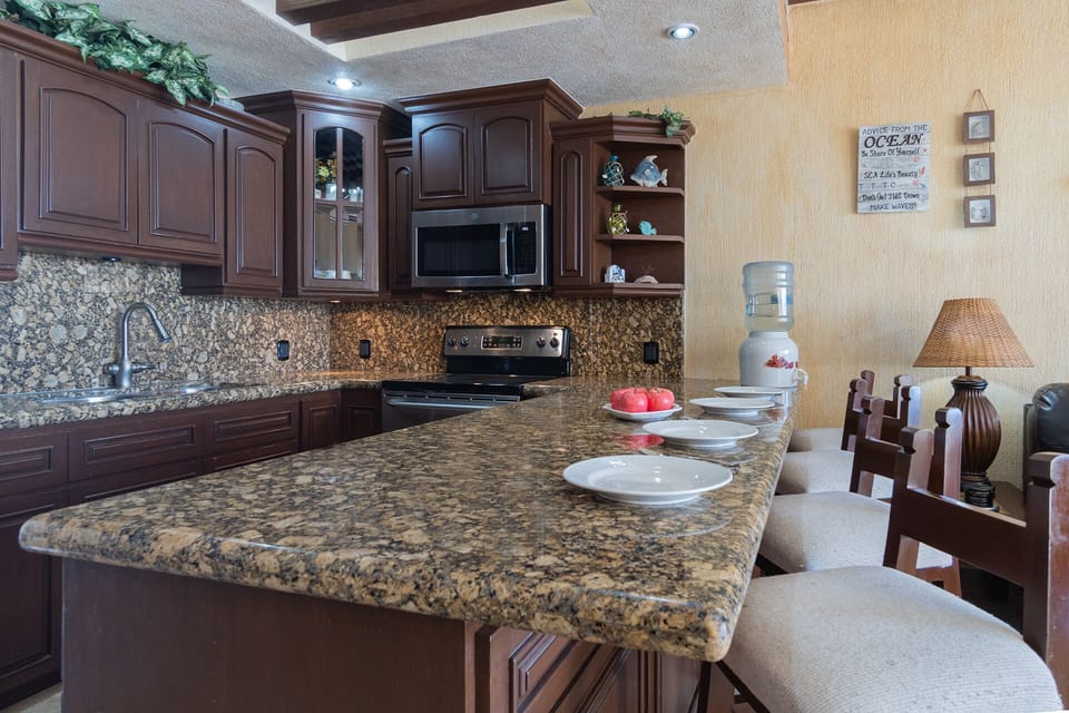 The counter at the kitchen is a great spot for a quick snack.