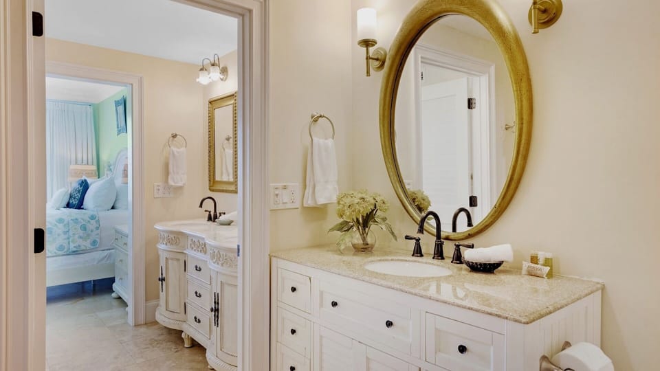 The master bathroom is en suite, with double vanities...