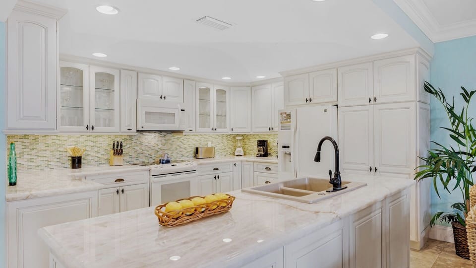 The kitchen has plenty of cabinet and countertop space...