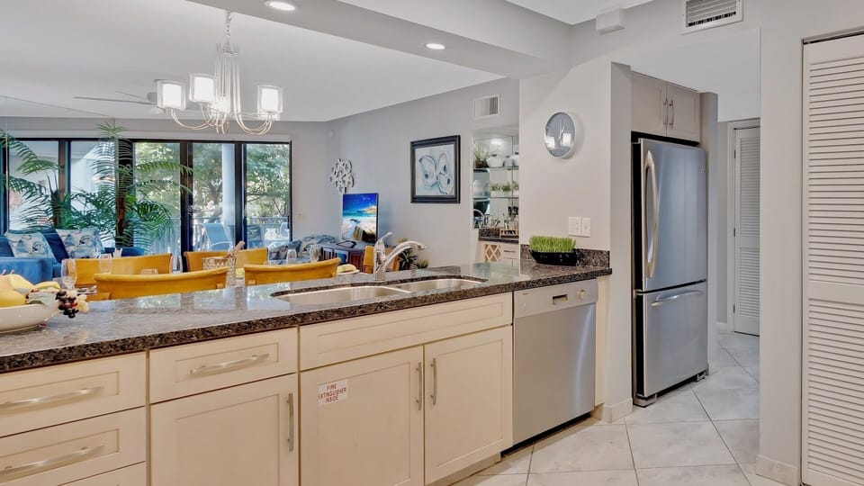The kitchen features stainless steel appliances...