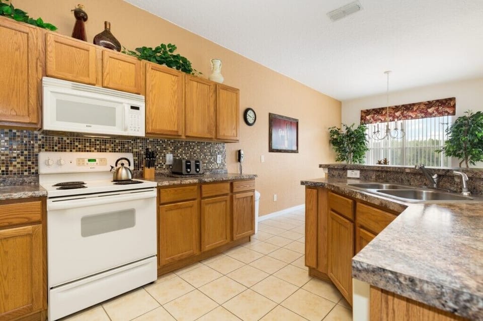 Fully equipped kitchen with modern appliances for easy meal preparation.