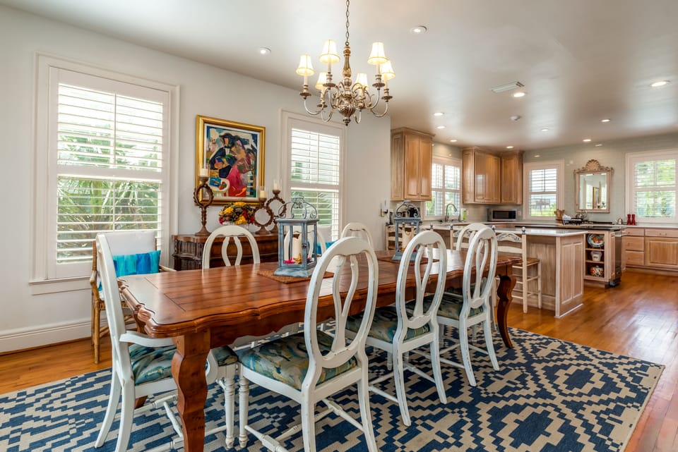Dining area with seating for 12 and stunning Gulf views at Soft Wind