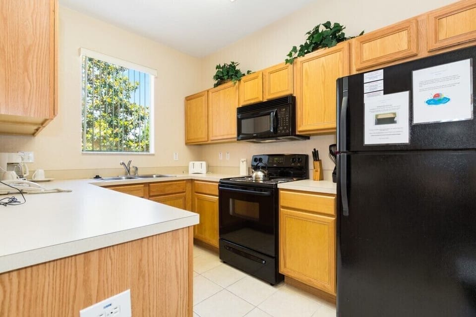Fully equipped kitchen with modern appliances for home-cooked meals.