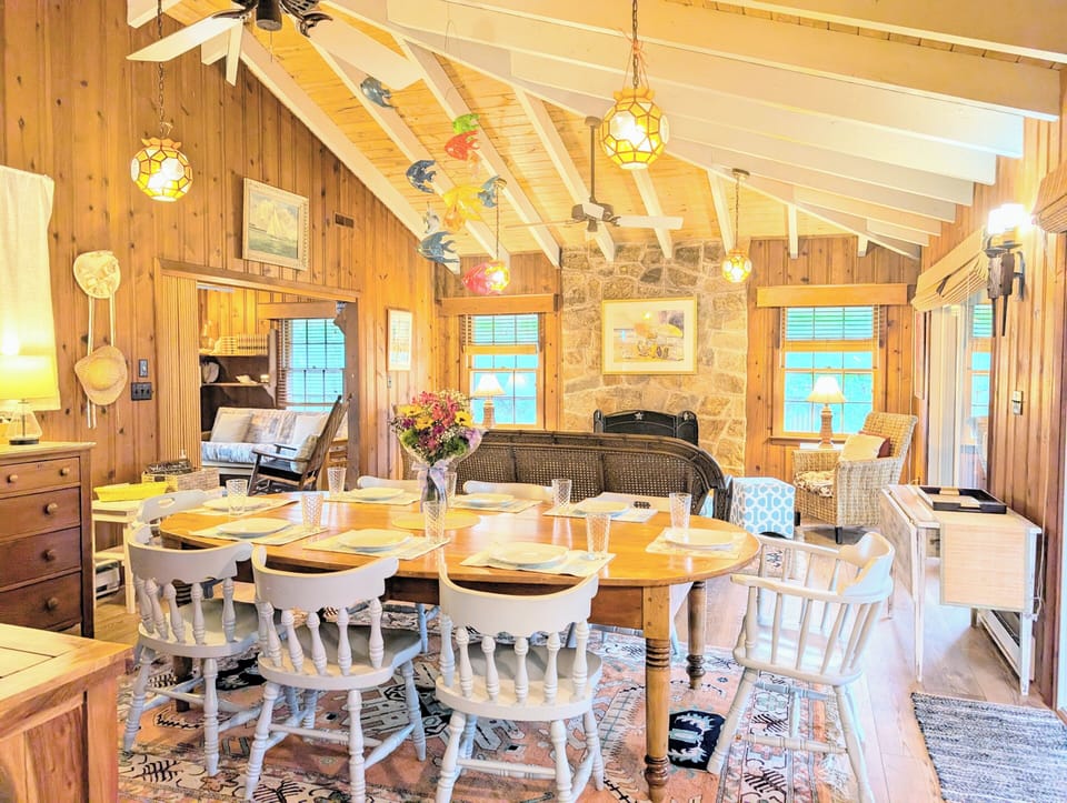 29554 N. Duneway - Cotton Patch East - Open Concept Gathering Sp - An alternate angle highlighting the flow between the rustic dining space and the cozy living room seating area.