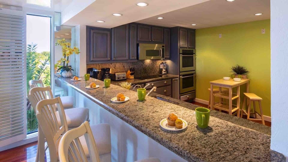 The kitchen is fully equipped with stainless steel appliances...