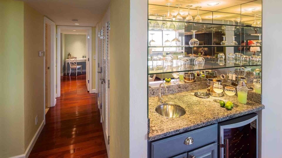 There is a wet bar located next to the hallway leading to the bedrooms...