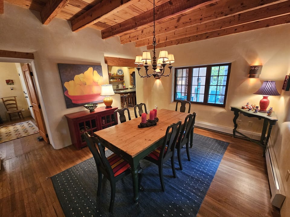 The dinning room leads to the kitchen on the right and guest bedroom on the left.