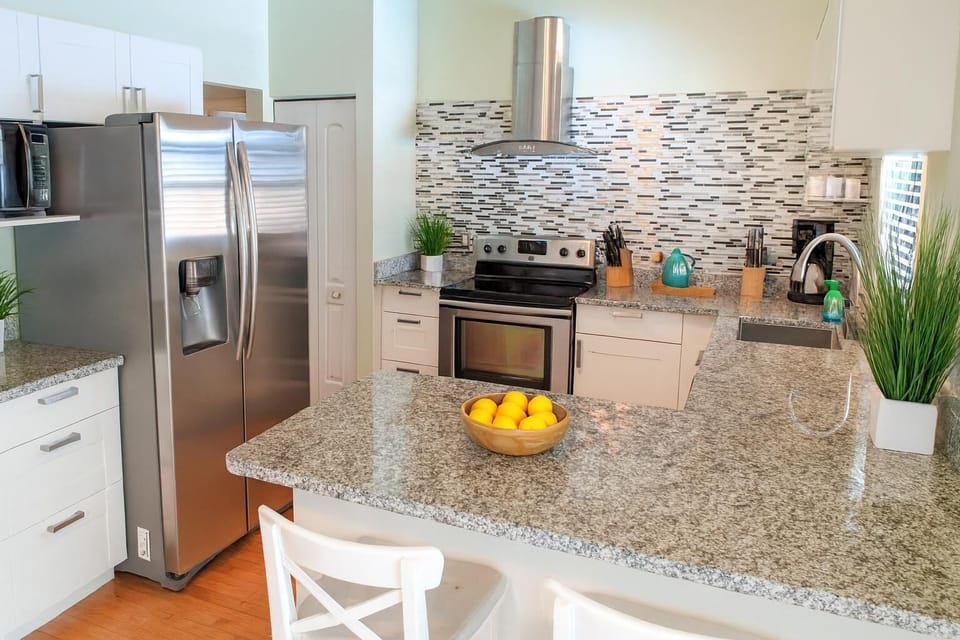 Modern kitchen with granite countertops and stainless steel appliances