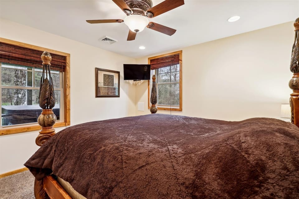 Bedroom 4 - Lower Level - King Size Bed. Goes out to recreation Room. Linens and sheets provided and professionally cleaned.