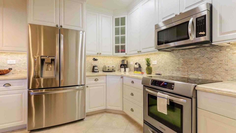 The kitchen has beautiful stainless steel appliances...
