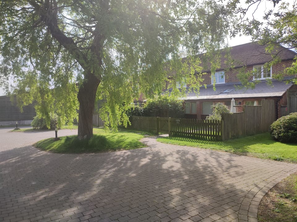 Barley cottage front , parking spaces , off road.