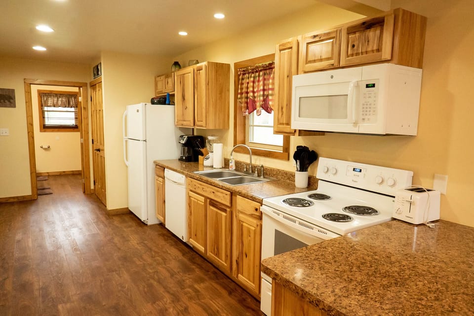 Kitchen - Main Level. Stocked kitchen with burner and oven.