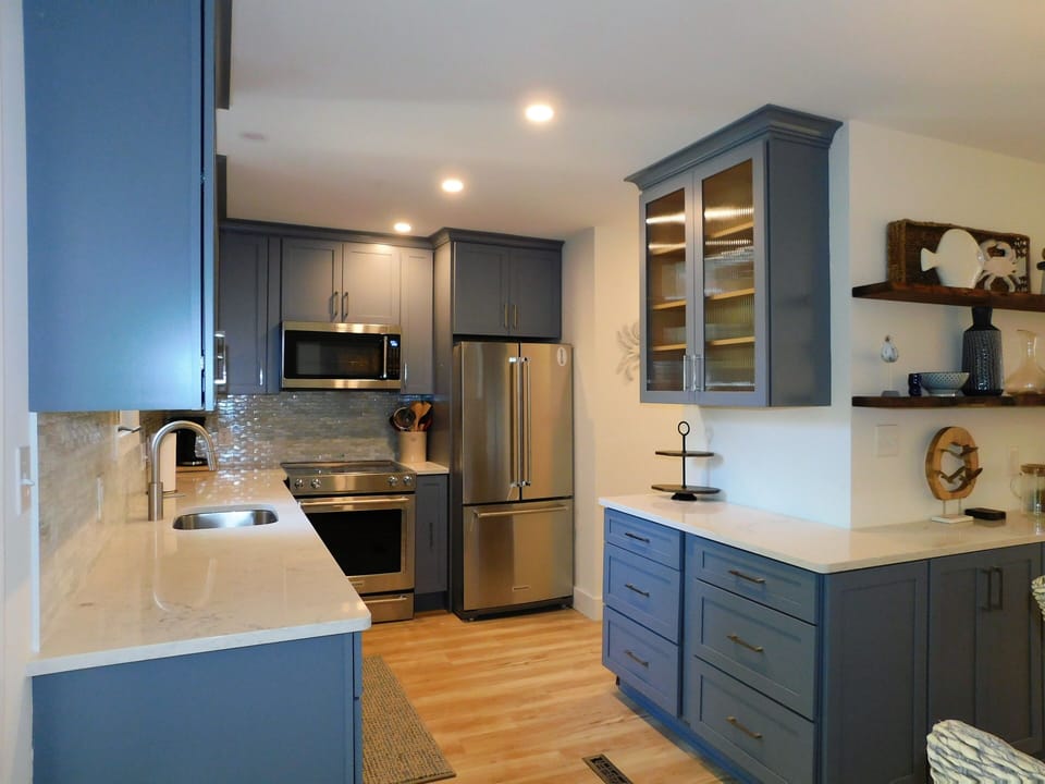 414 Bethany Pines, Bethany Beach - kitchen workspace - Close-up of the kitchen highlighting the ample counter space, built-in shelving, and contemporary finishes.