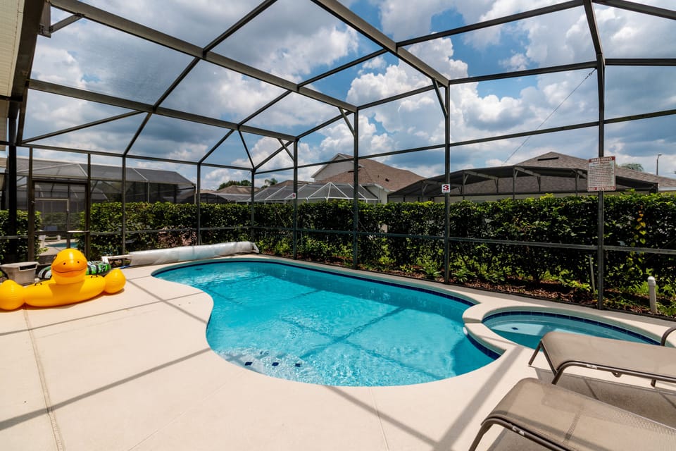 Another view of the inviting private pool, surrounded by privacy hedges for a serene retreat.
