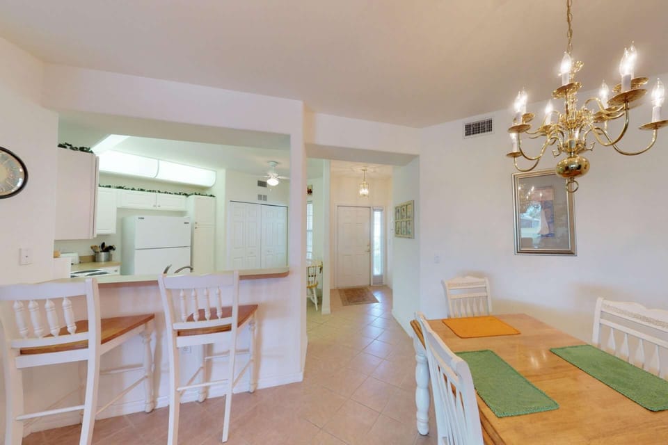 Dining for four and barstools at the pass thru kitchen eating bar provide plenty of seating for you and your guests.