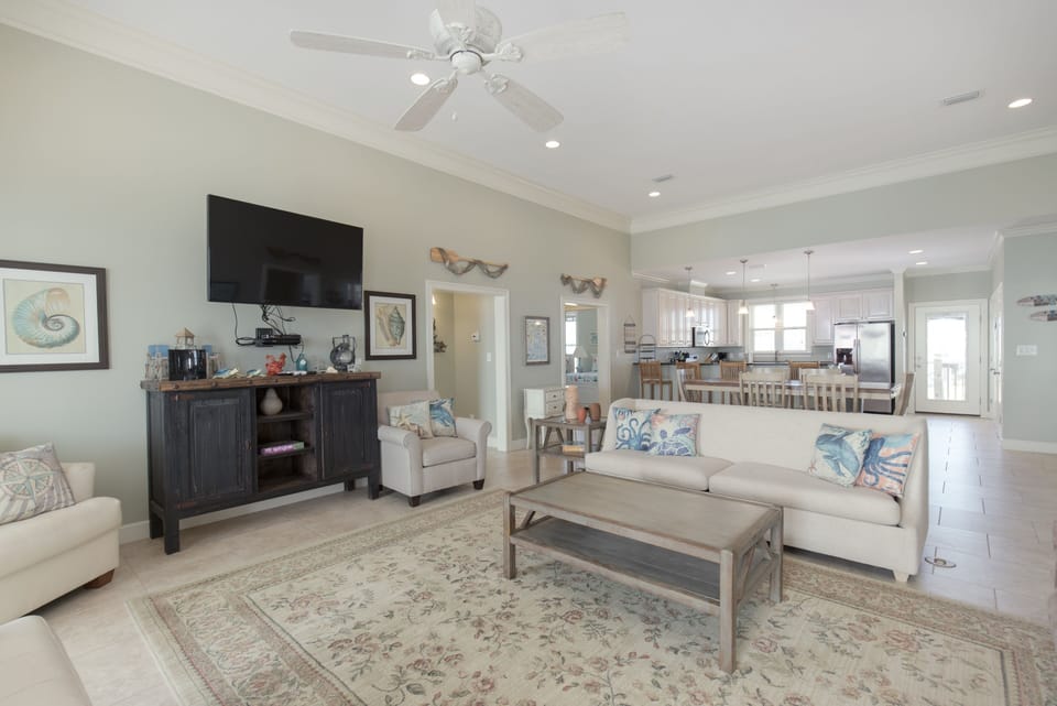 Large high ceiling open floor plan living room. This home is a great location for relaxing or adventure filled vacations in Dauphin Island!