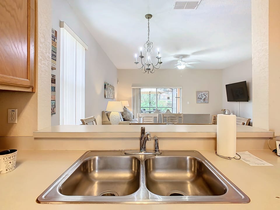 Double sink with a view of the bright living and dining spaces.