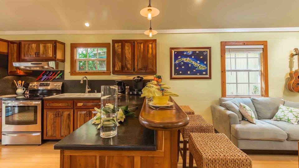The kitchen bar has seating for three...