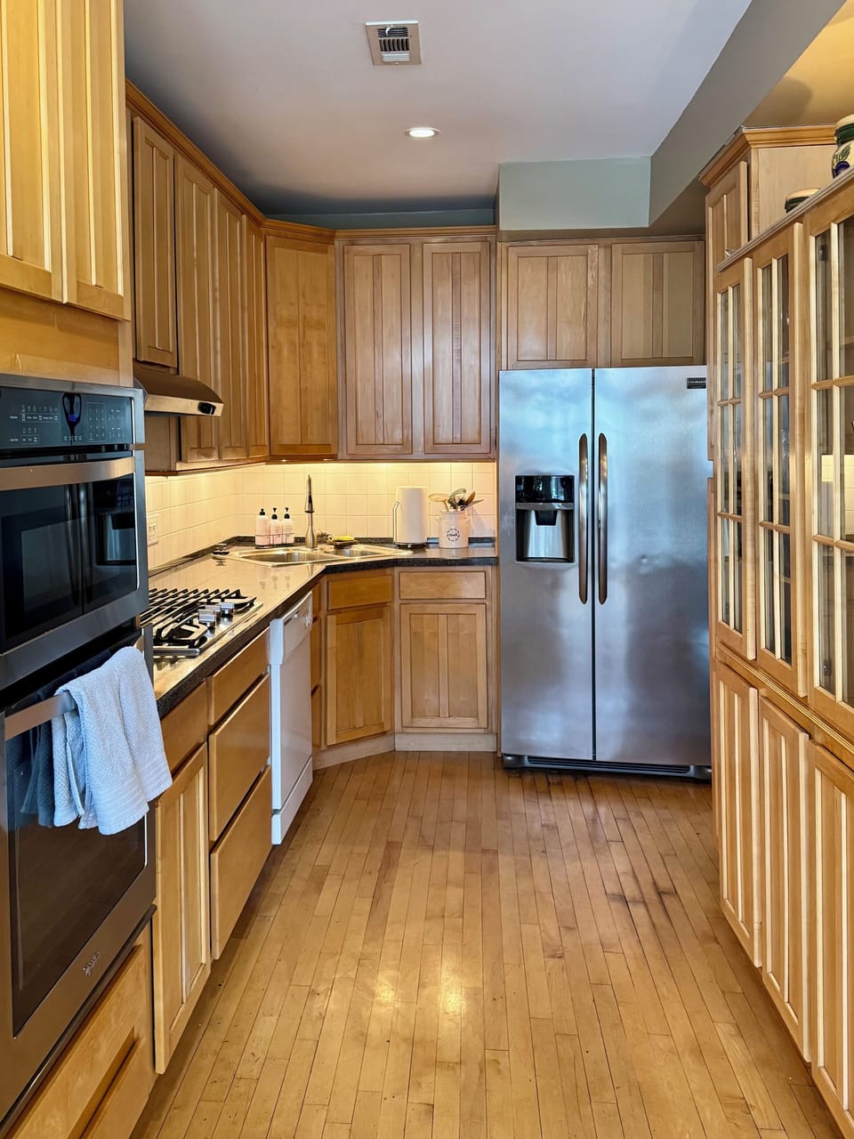 Kitchen has custom cabinets and granite counter tops
