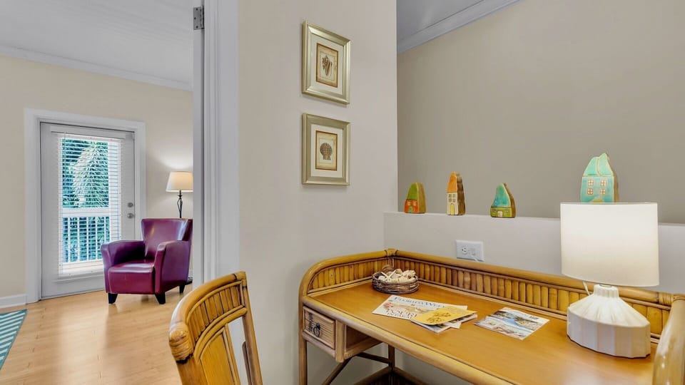 Settle into this quiet desk nook with room to organize and get inspired. Soft light, charming décor, and a comfortable chair nearby invite you to work or plan your next adventure.