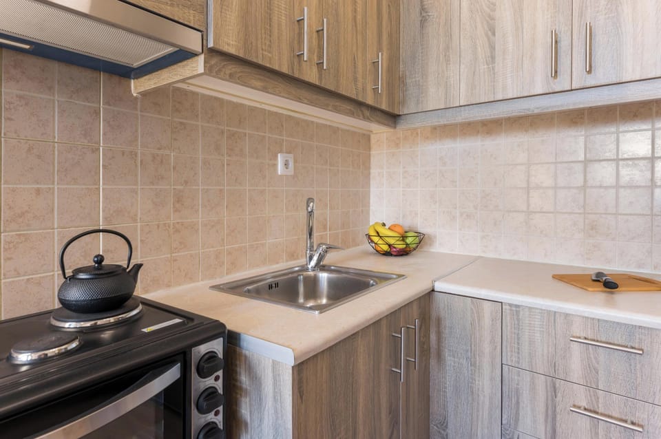 Royal Studio With Courtyard View | Private kitchen | Full-size fridge, stovetop, espresso maker, coffee/tea maker