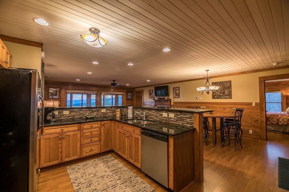Kitchen with stainless steel appliances and granite counters